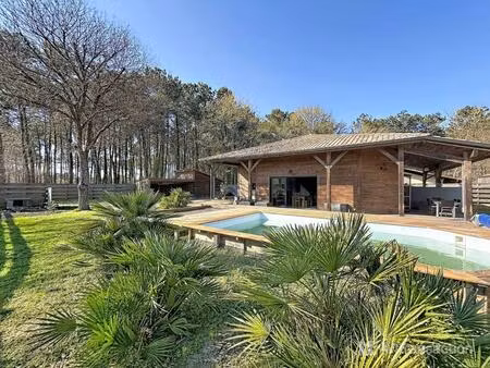 maison ossature bois au cœur des pins – entre lac et océan