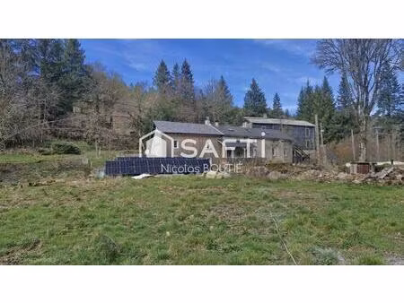 maison en pierre avec terrain en bord de rivière