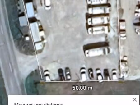 terrain de stockage  nu empierré et cloturé avec portail