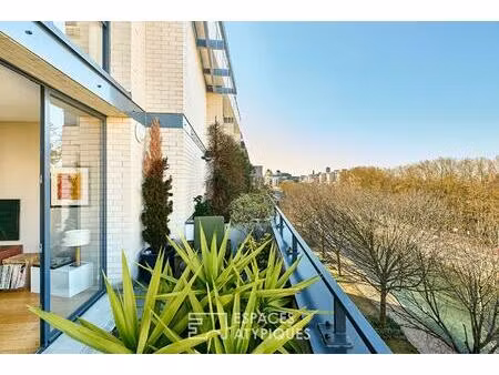 duplex en dernier étage avec terrasses sur le canal