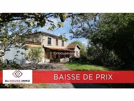 corps de ferme en pierre blanche comprenant 2 maisons sur 1 ha de terrain arboré et...