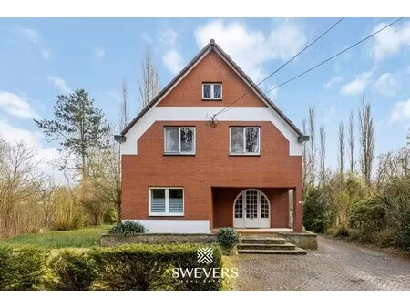 ruime te renoveren woning op zonnig perceel van 2.325 m² nabij centrum zonhoven