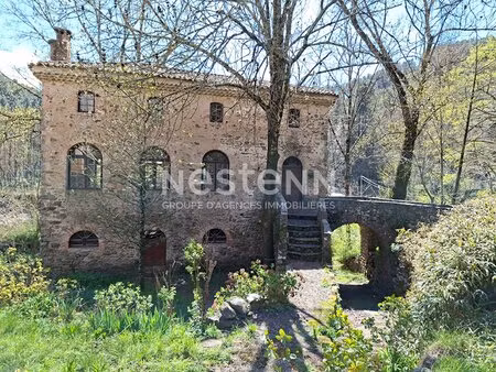 propriété en perre en bord de rivière