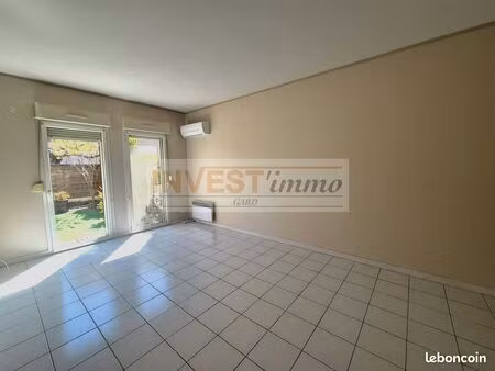 agréable p2 au centre de bouillargues  avec terrasse et parking