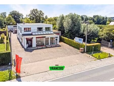 wonen (appartement) en werken (winkelruimte en atelier) op …