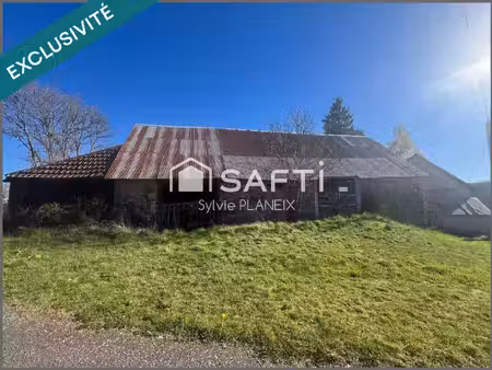 grange de 200 m2 environ avec étable  terrain de 1860 m2.