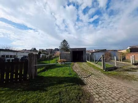 terrain à bâtir+grand garage de 12m avec parking 2 voitures