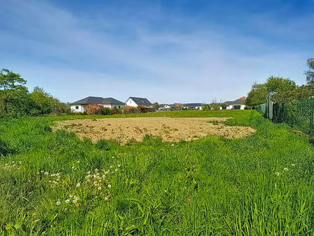 a vendre à assat en limite de meillon terrain constructible viabilisé de 1251 m² au calme 