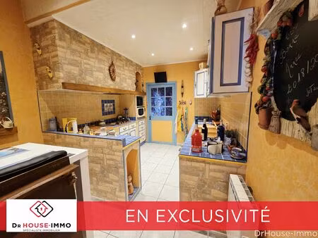 maison 100m² avec grand garage.