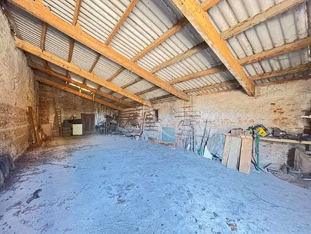 grande maison de caractère avec garages sur la commune de gémil !