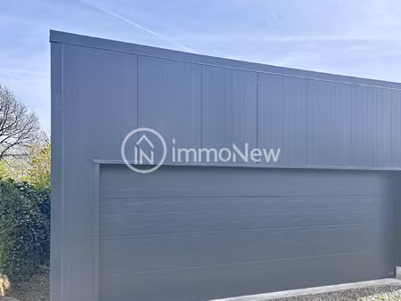hangar neuf 62 m2 avec porte sectionnelle sur terrain enviro