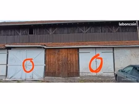 2 garages bois sol béton fosse