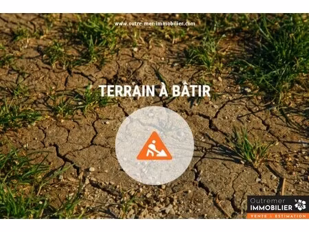 terrain 955 m² zone uc – accès facile