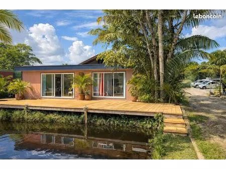 location – espace moderne avec terrasse sur l’eau & espace bien-être