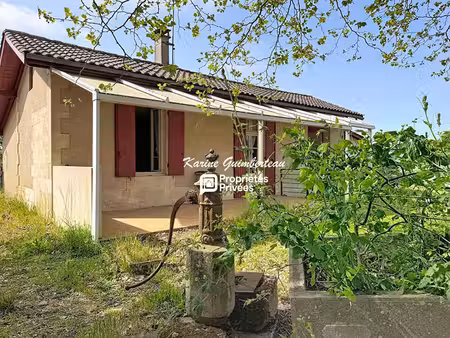 maison en pierre avec garage et jardin