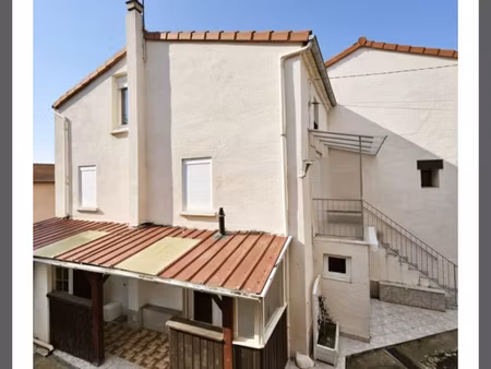 maison avec terrain garage et piscine en plein centre ville