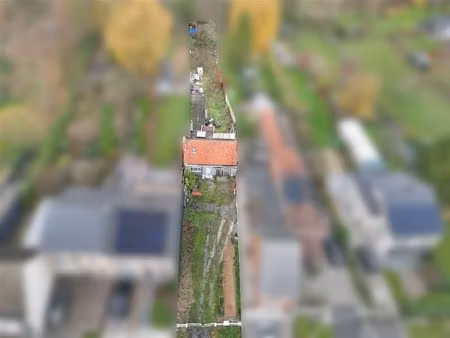 bouwgrond met pand op toplogging in wetteren.