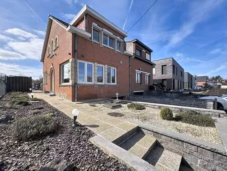 dilbeek: maison 3 façades avec veranda & jardin bien orienté