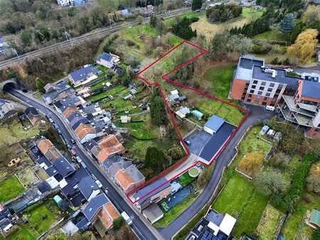 ensemble immobilier polyvalent (garages + entrepot+ terrain)