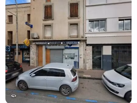 immeuble commerce et habitation