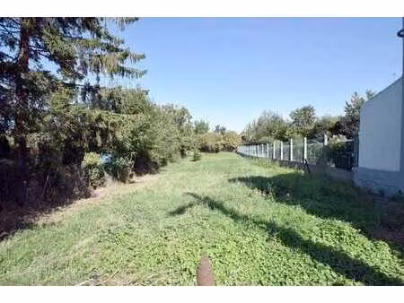 terrain à bâtir de 8 ares 10 ca  proposant 10 mètres de faça