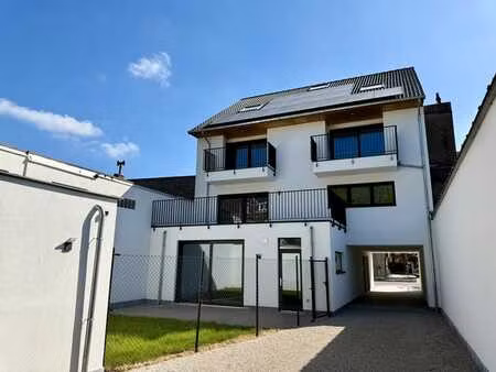 ruim nieuwbouwappartement met 2 slaapkamers én parkeerpla...