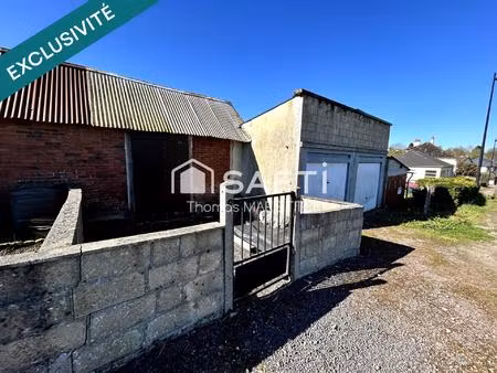 garage avec cave  remise et terrasse
