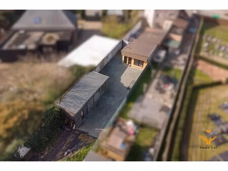 perceel met 2 garages en carport