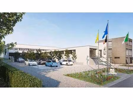 cabinet de groupe ou immeuble commercial avec parking  situé