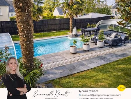 maison avec piscine. commerces à pied et cadre privilégié sur 930 m² de terrain. 15 minute