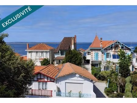 dernier étage avec rooftop  vue bassin et plage à pied