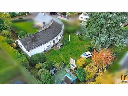 maison 3 façades plain-pied avec terrain à bâtir (±1115 m²)