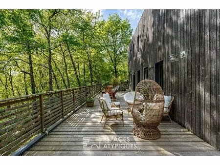 maison ossature bois avec terrasse et jardin dans un ecrin de nature