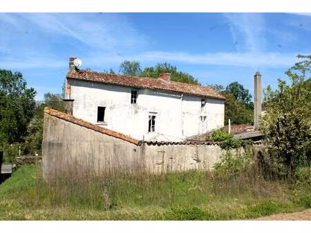 ensemble de 2 maisons et un terrain constructible
