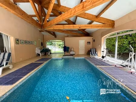 villa de plain-pied  170 m²  piscine intérieure  parc arboré  garage