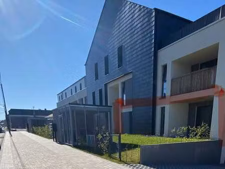 appartement neuf 1 ch + coin bureau  jardin  cave   parking!