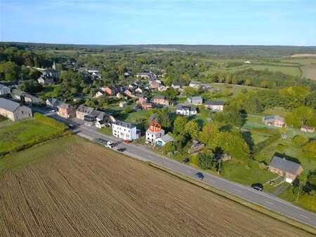 vonêche - terrain avec un gros oeuvre pratiquement terminé.