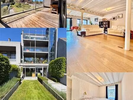 magnifique loft 2 chambres avec terrasse et 2pl. de parking!