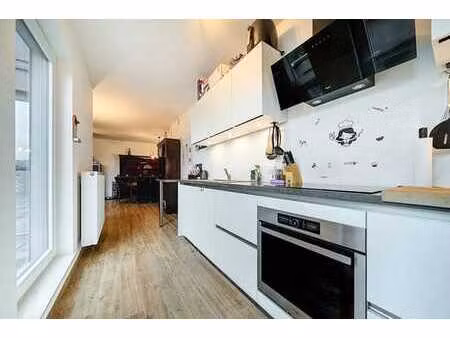 appartement état neuf avec terrasse - cave et garage inclus