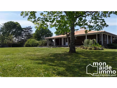 superbe maison en bois sur grand terrain arboré