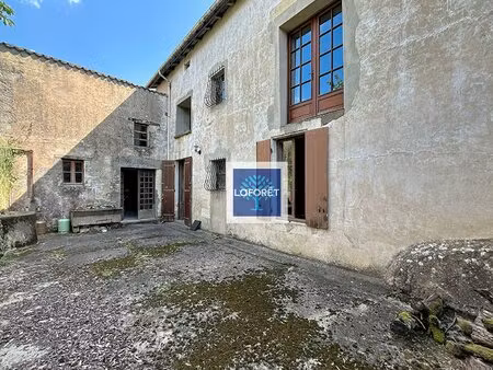 immeuble composé d'une maison et d'un local  jardin et dépendance