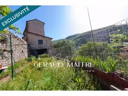 maison 5 ch avec jardin et garage  vue sur la rivière.