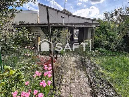 à 2 pas du centre ville maison individuelle avec garage et jardin
