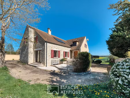 maison familiale au coeur de la nature avec terrain paysager