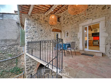 maison de village singulière avec cour  terrasses et garage