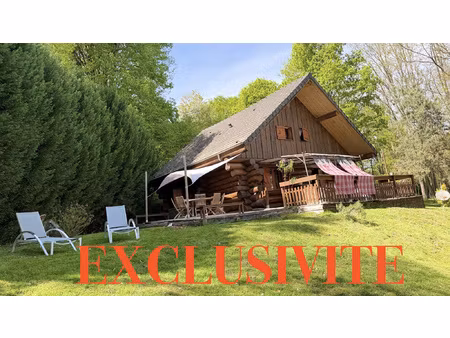 superbe chalet en rondins au coeur d'un écrin de verdure