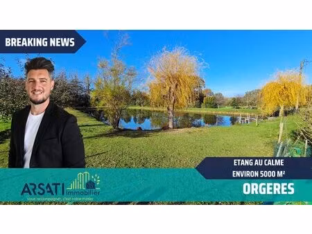 etang poissonneux  clos et arboré d'arbres fruitiers. au calme.
