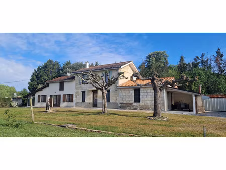 propriété comprenant deux maisons  grand garage et parc arbo