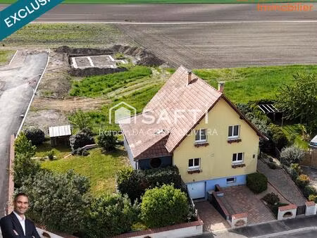 jolie maison de 5 pièces disposant d'une véranda  d'un sous sol et d'un grand jardin de 5 