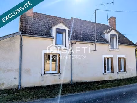 vouillon  longère t3 avec jardin et 2 garages.